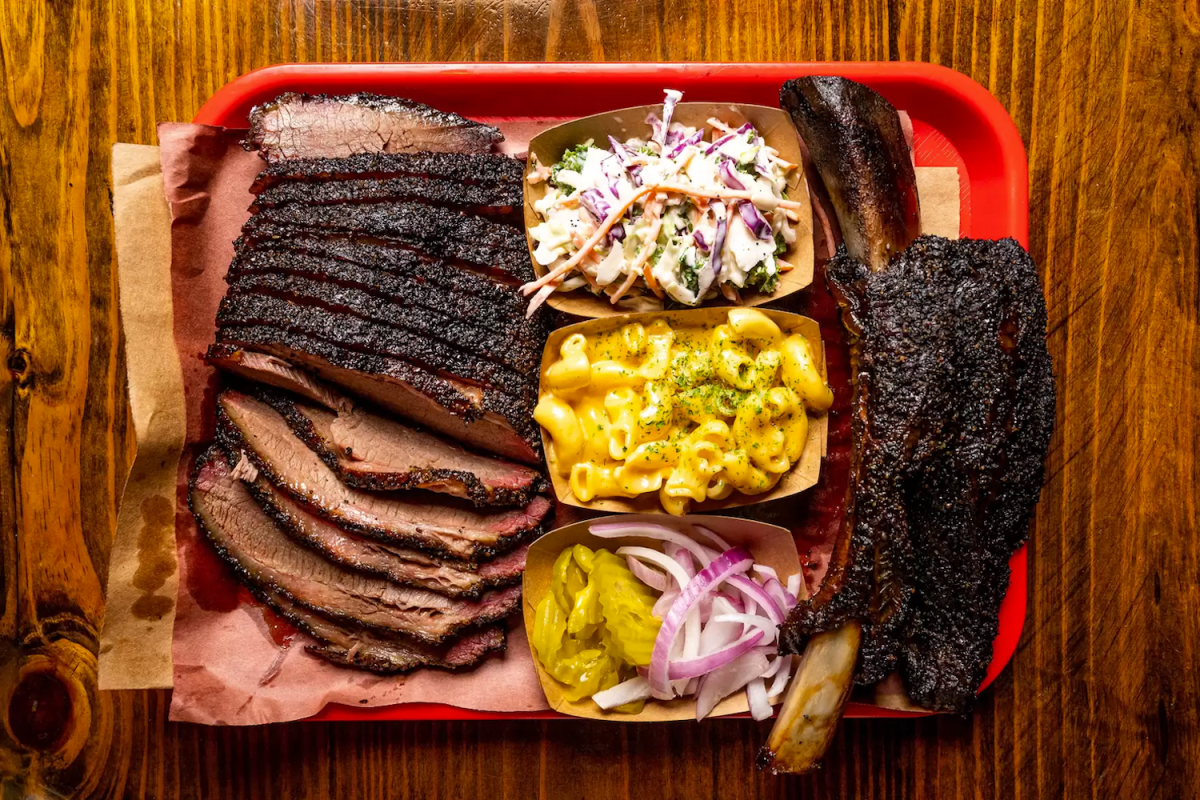 BBQ on a plate, including meat, picked sides, coleslaw and mac and cheese, from Terry Black's, one of the best BBQ joints in Austin, Texas