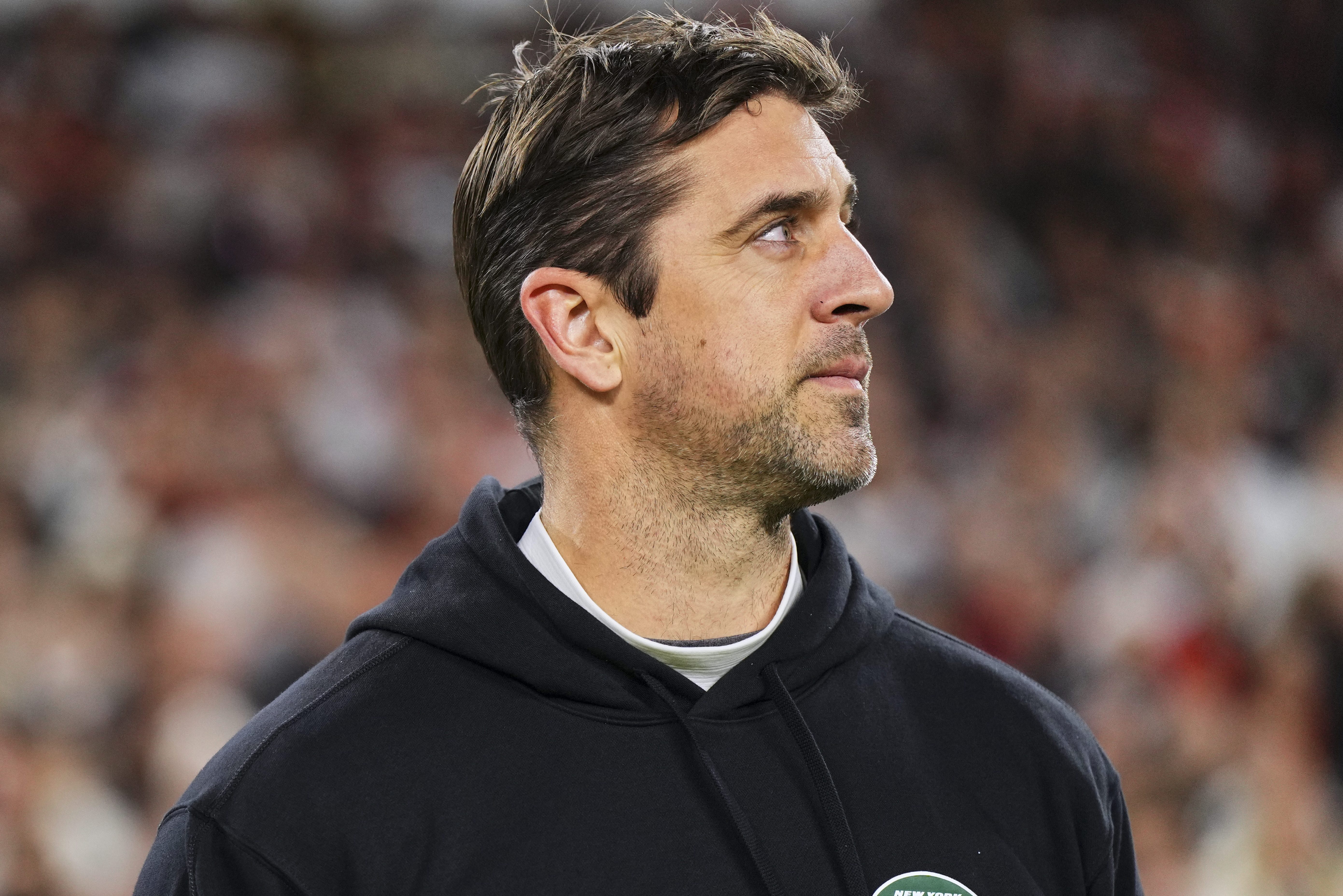 Aaron Rodgers looks on before the Jets kickoff.