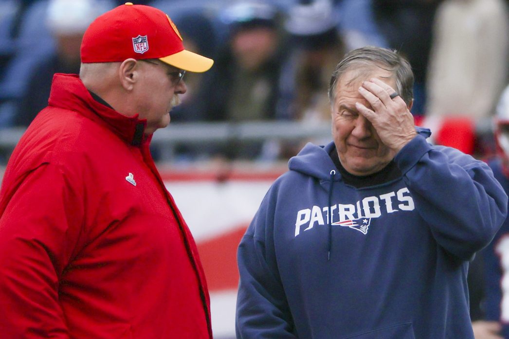 Bill Belichick and Andy Reid chat before a game.