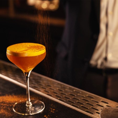 A drink at Manhattan's Back Bar, where a selection of certain cocktails is always $12