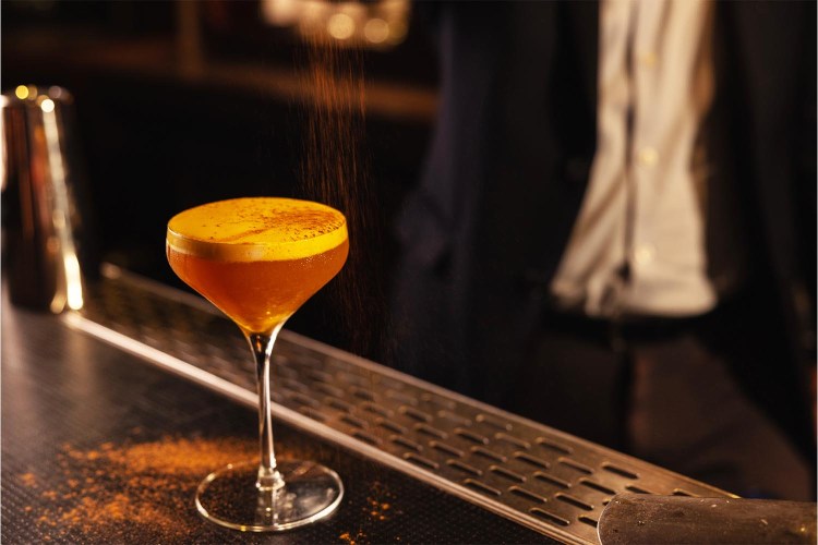 A drink at Manhattan's Back Bar, where a selection of certain cocktails is always $12