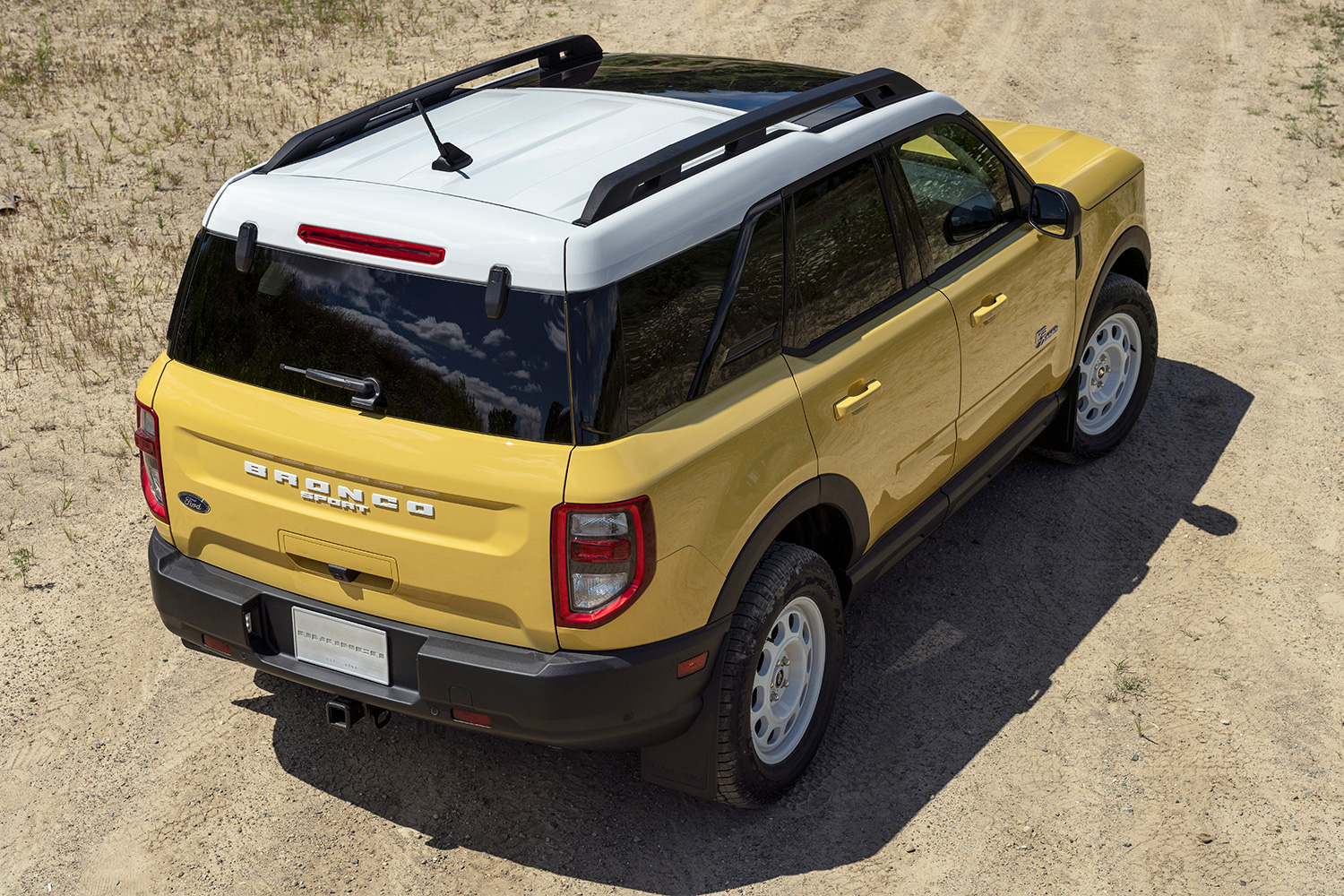 The rear end and side of the Ford Bronco Sport Heritage Edition SUV in yellow