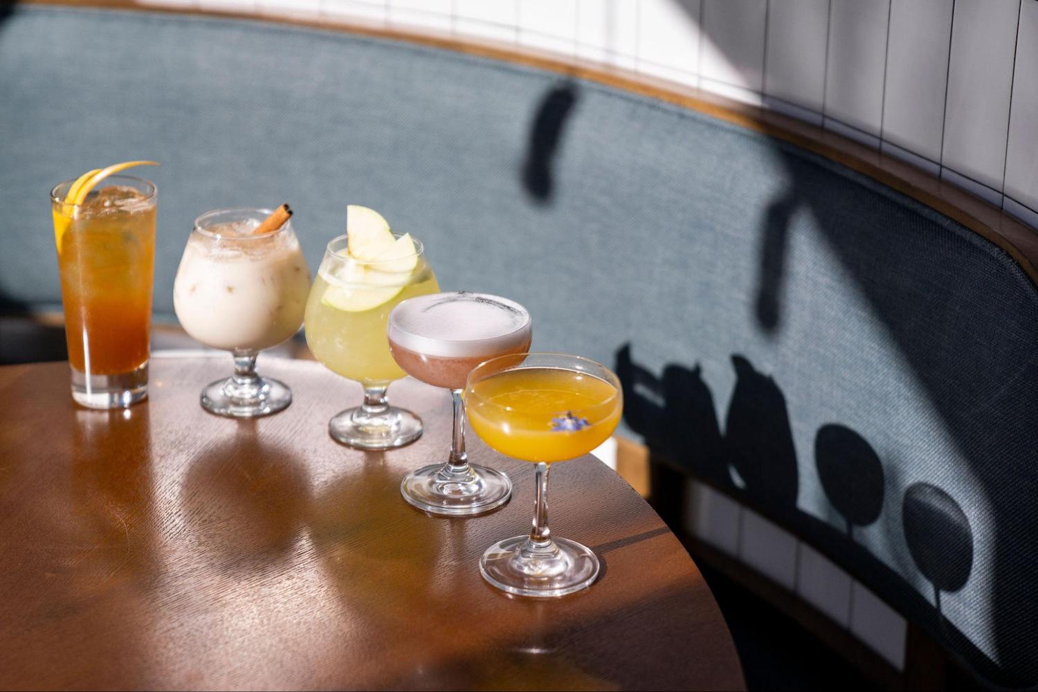 Cocktails lined up on a table 