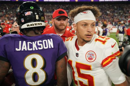 Lamar Jackson talks with Patrick Mahomes after a game.