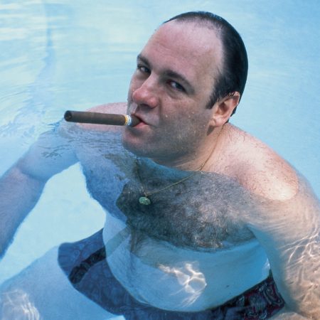 James Gandolfini, as Tony Soprano, smokes a cigar.