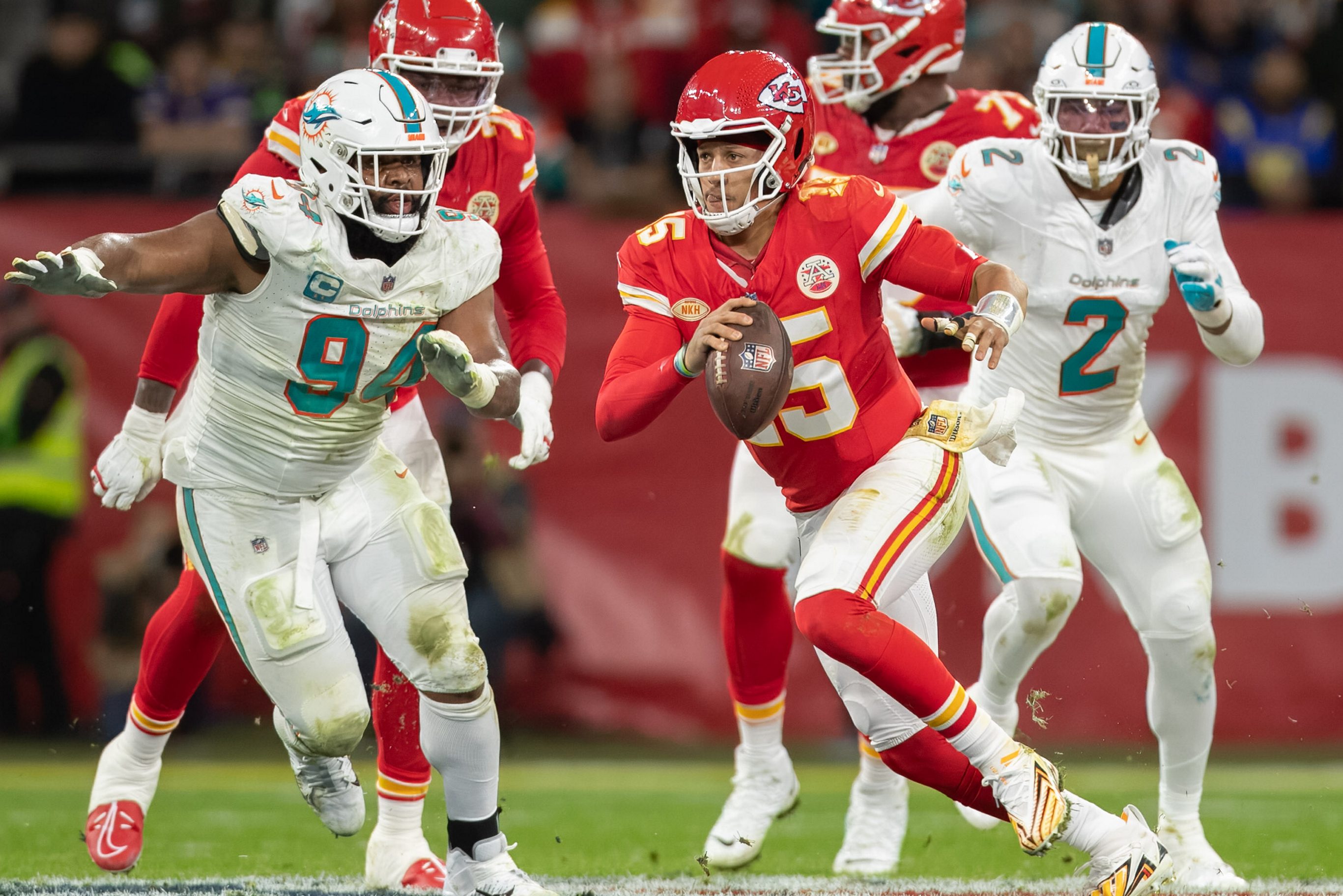 Patrick Mahomes scrambles against the Miami Dolphins.