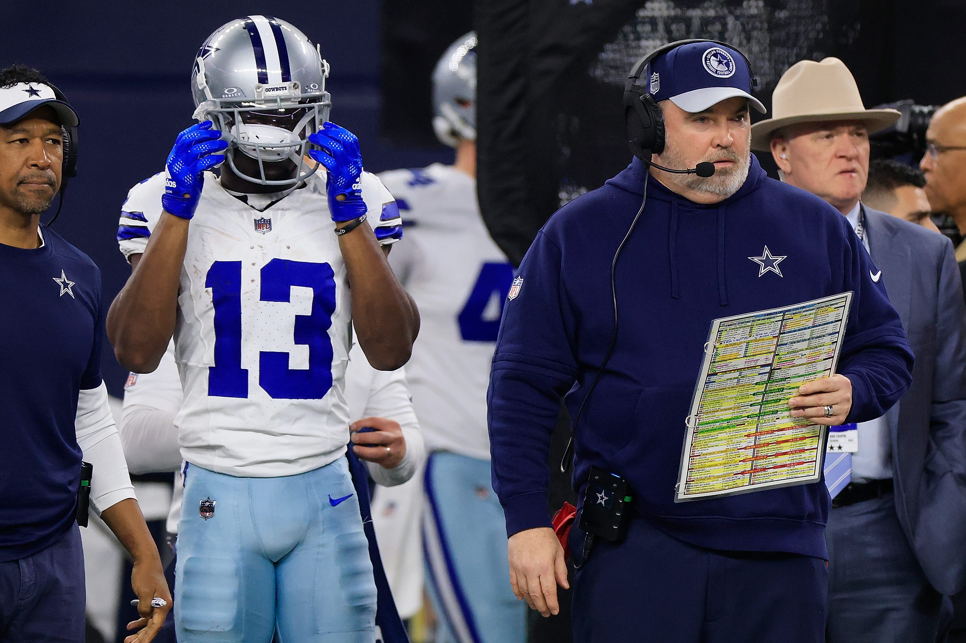 Mike McCarthy watches the Dallas Cowboys.