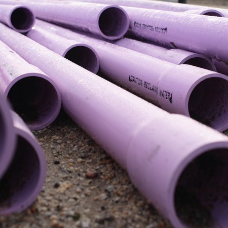 A close-up of purple PVC pipes.