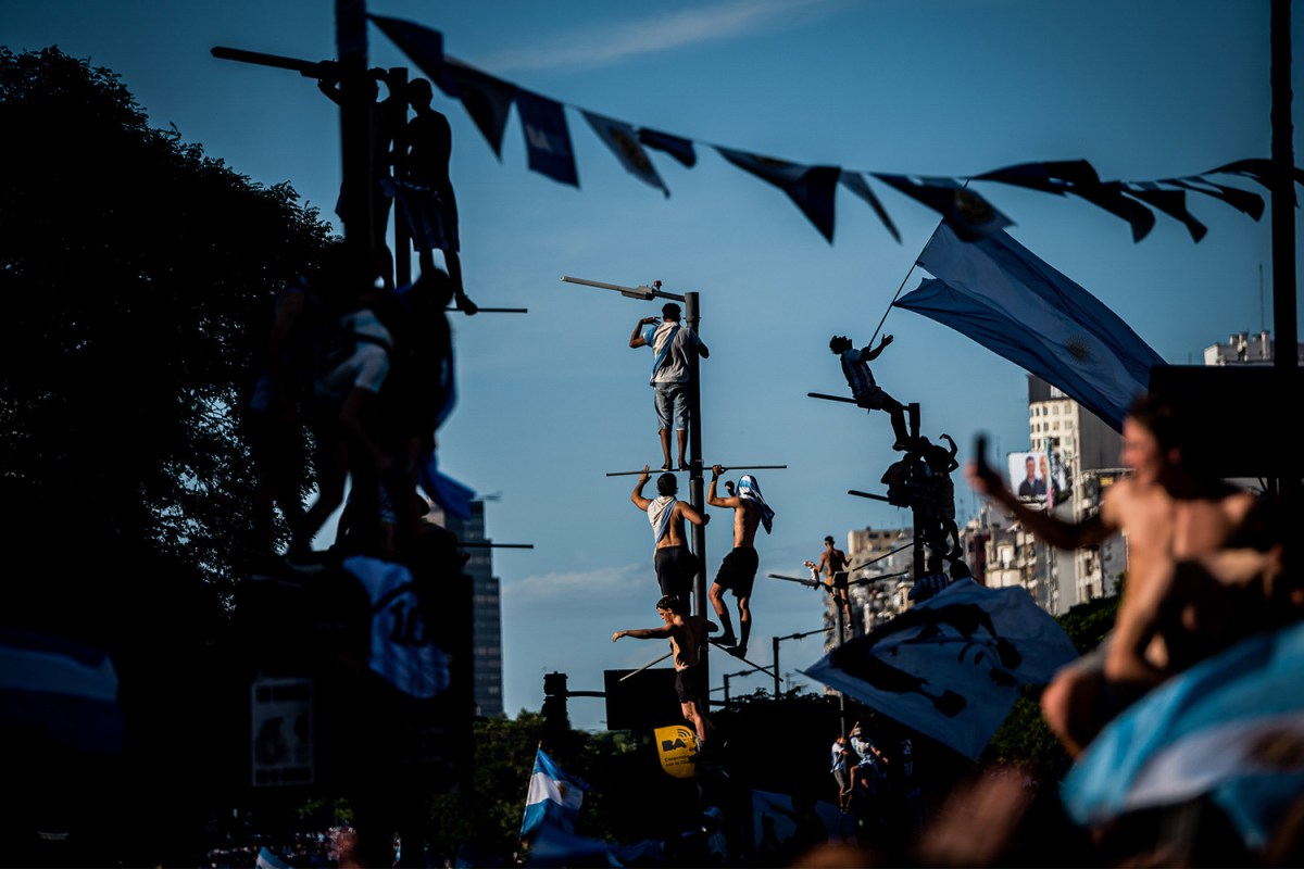 A photograph from Argentina's World Cup-winning parade in 2022. Here's why sports fandom, whether it results in a championship or not, is good for your mental health and the health of society.