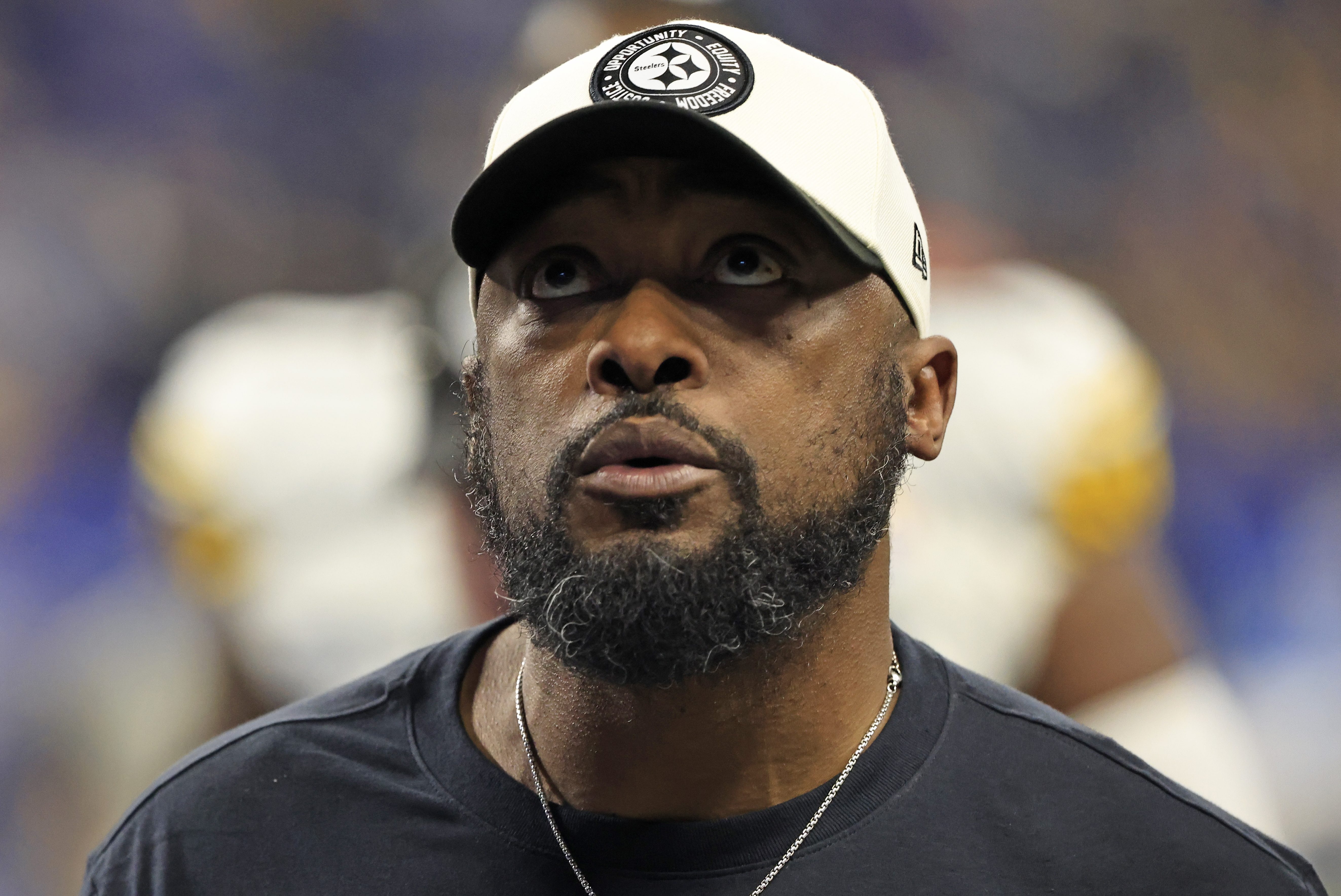 Mike Tomlin of the Steelers walks off the field against the Colts.