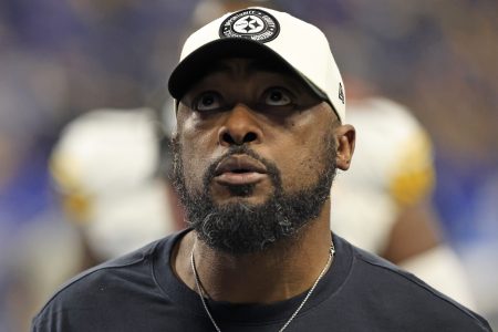 Mike Tomlin of the Steelers walks off the field against the Colts.