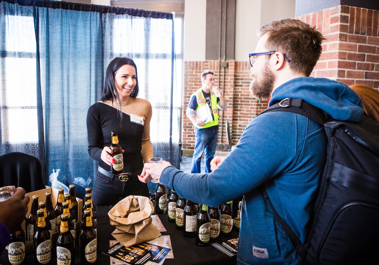 Person pouring cider at Cider Summit Chicago