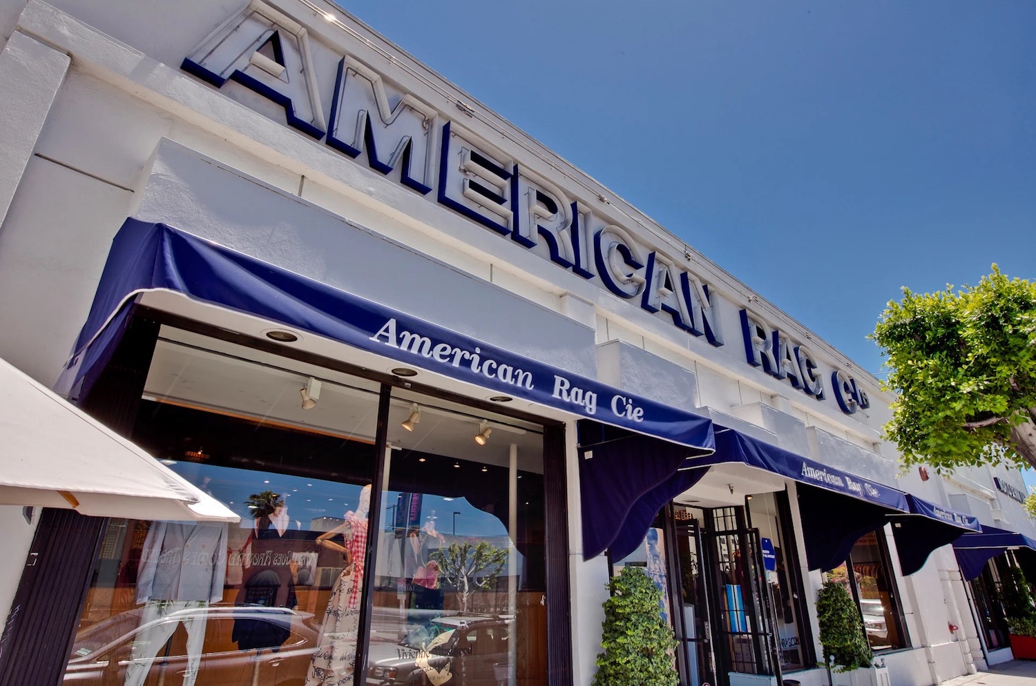 Exterior of American Rag with a large sign that says "AMERICAN RAG"