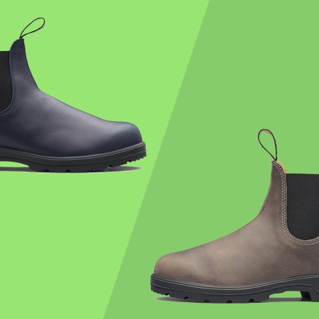 Two blundstone boot on a green background