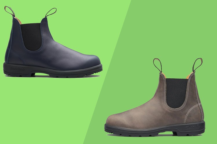 Two blundstone boot on a green background