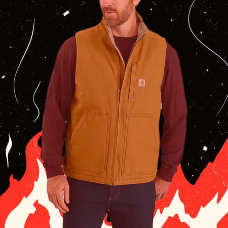 A model wearing a Carhartt vest, on a vintage flame background.