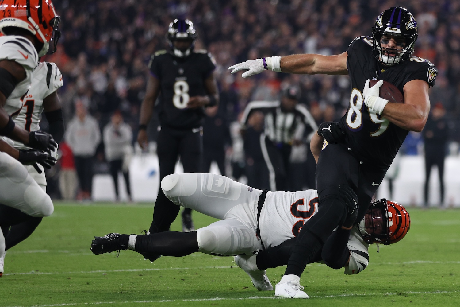 Mark Andrews #89 of the Baltimore Ravens is tackled by Logan Wilson #55 of the Cincinnati Bengals during the first quarter of the game at M&T Bank Stadium on November 16, 2023 in Baltimore, Maryland. Andrews was injured on the play with a hip-drop tackle.