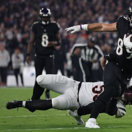 Mark Andrews #89 of the Baltimore Ravens is tackled by Logan Wilson #55 of the Cincinnati Bengals during the first quarter of the game at M&T Bank Stadium on November 16, 2023 in Baltimore, Maryland. Andrews was injured on the play with a hip-drop tackle.