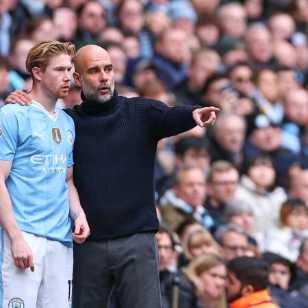 MANCHESTER, ENGLAND - FEBRUARY 10: Kevin De Bruyne and Pep Guardiola the head coach / manager of Manchester City during the Premier League match between Manchester City and Everton FC at Etihad Stadium on February 10, 2024 in Manchester, England. (Photo by Robbie Jay Barratt - AMA/Getty Images)