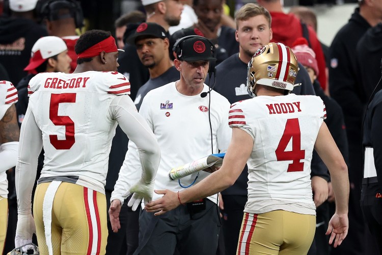 LAS VEGAS, NEVADA - FEBRUARY 11: Head coach Kyle Shanahan of the San Francisco 49ers celebrates with Jake Moody #4 after he kicked a Super Bowl record setting 55-yard field goal in the second quarter against the Kansas City Chiefs during Super Bowl LVIII at Allegiant Stadium on February 11, 2024 in Las Vegas, Nevada. (Photo by Steph Chambers/Getty Images)