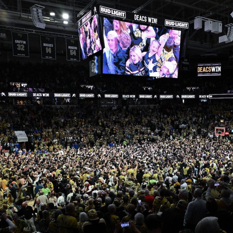 WINSTON SALEM, NORTH CAROLINA - FEBRUARY 24: Wake Forest Demon Deacons fans storm the court after a win Duke Blue Devils at Lawrence Joel Veterans Memorial Coliseum on February 24, 2024 in Winston Salem, North Carolina. Wake Forest won 83-79. (Photo by Grant Halverson/Getty Images)
