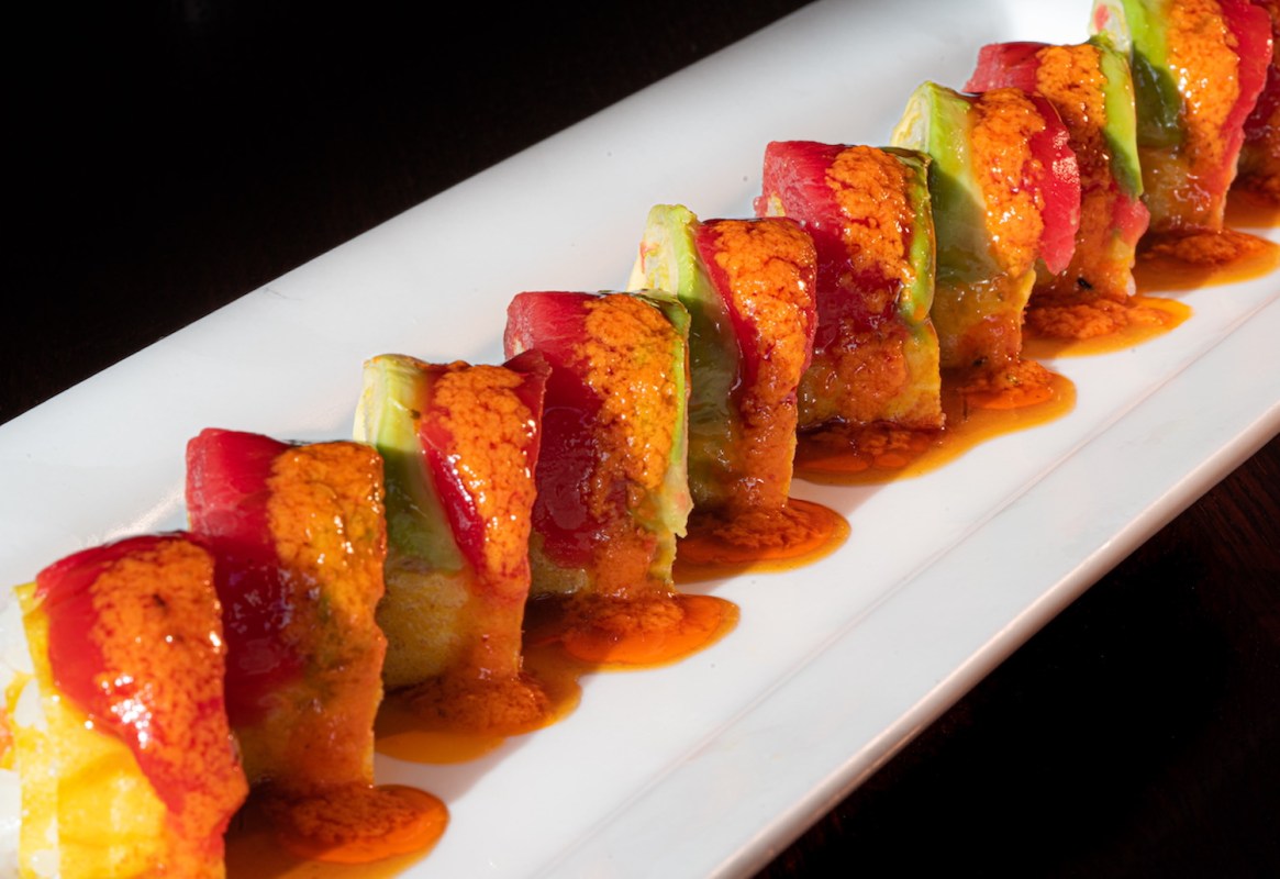A sushi roll on a plate at Tanoshii, one of the best sushi restaurants in Chicago, Illinois