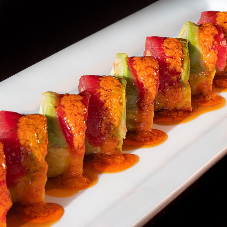 A sushi roll on a plate at Tanoshii, one of the best sushi restaurants in Chicago, Illinois