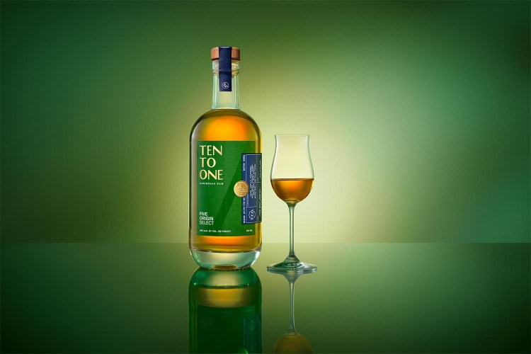 A bottle of Ten to One Five Origin Select, a new sipping rum (with a glass of rum poured neat)