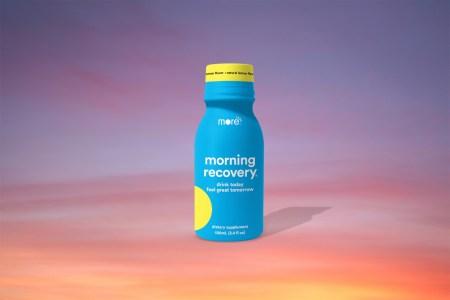 A bottle of Morning Recovery from More Labs against a sunrise background. Is it a hangover cure? We tested it.