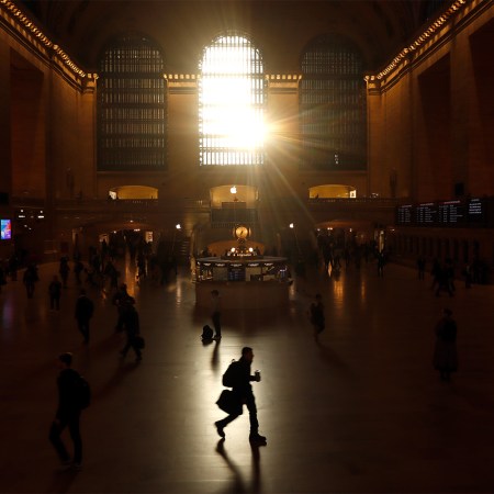 A man power-walking through Grand Central during his commute.