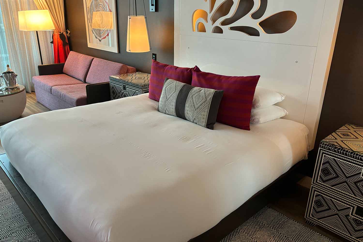 A king-size bed in a room at the Kimpton Seafire Resort
