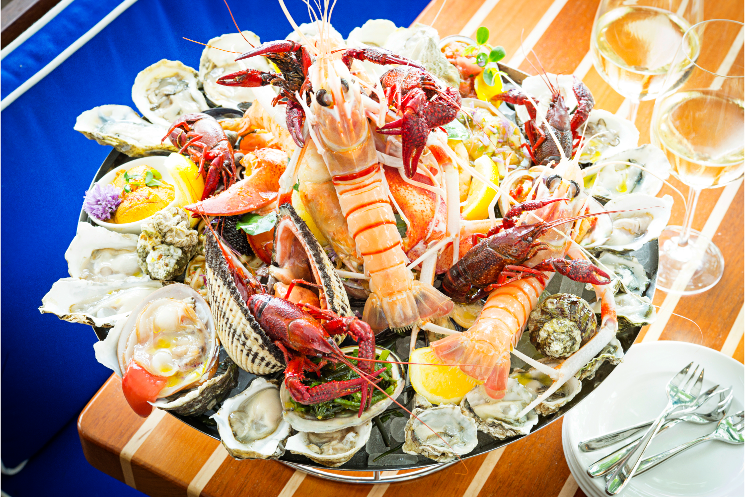 seafood, lobster, shrimp, clams, oysters, lemon, garnish, wine glass 