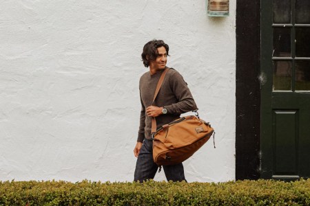 a model wearing wills clothing on holding a bag