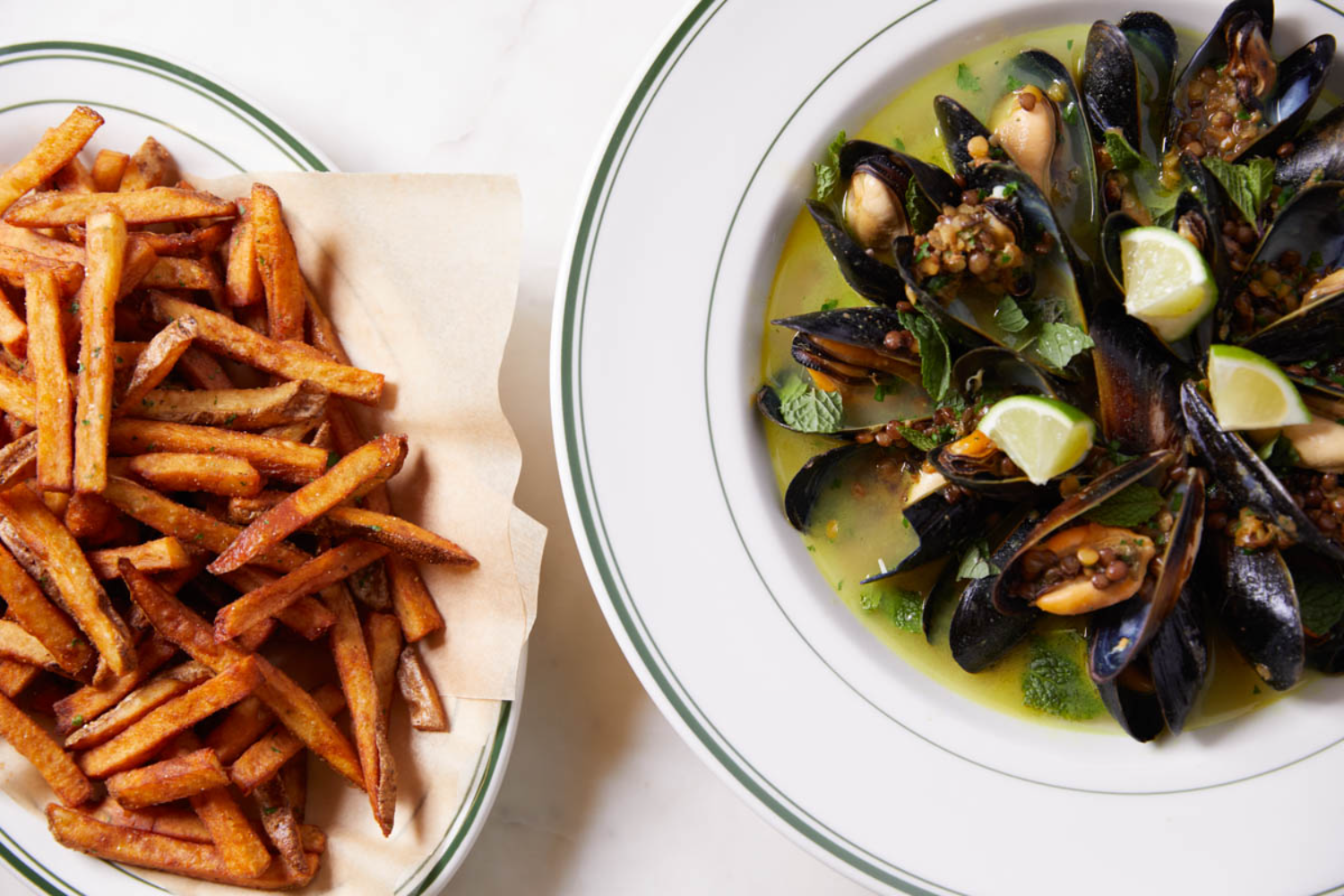 mussels on a plate, french fries on a plate