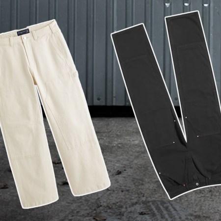 two pairs of workwear pants on a steel background