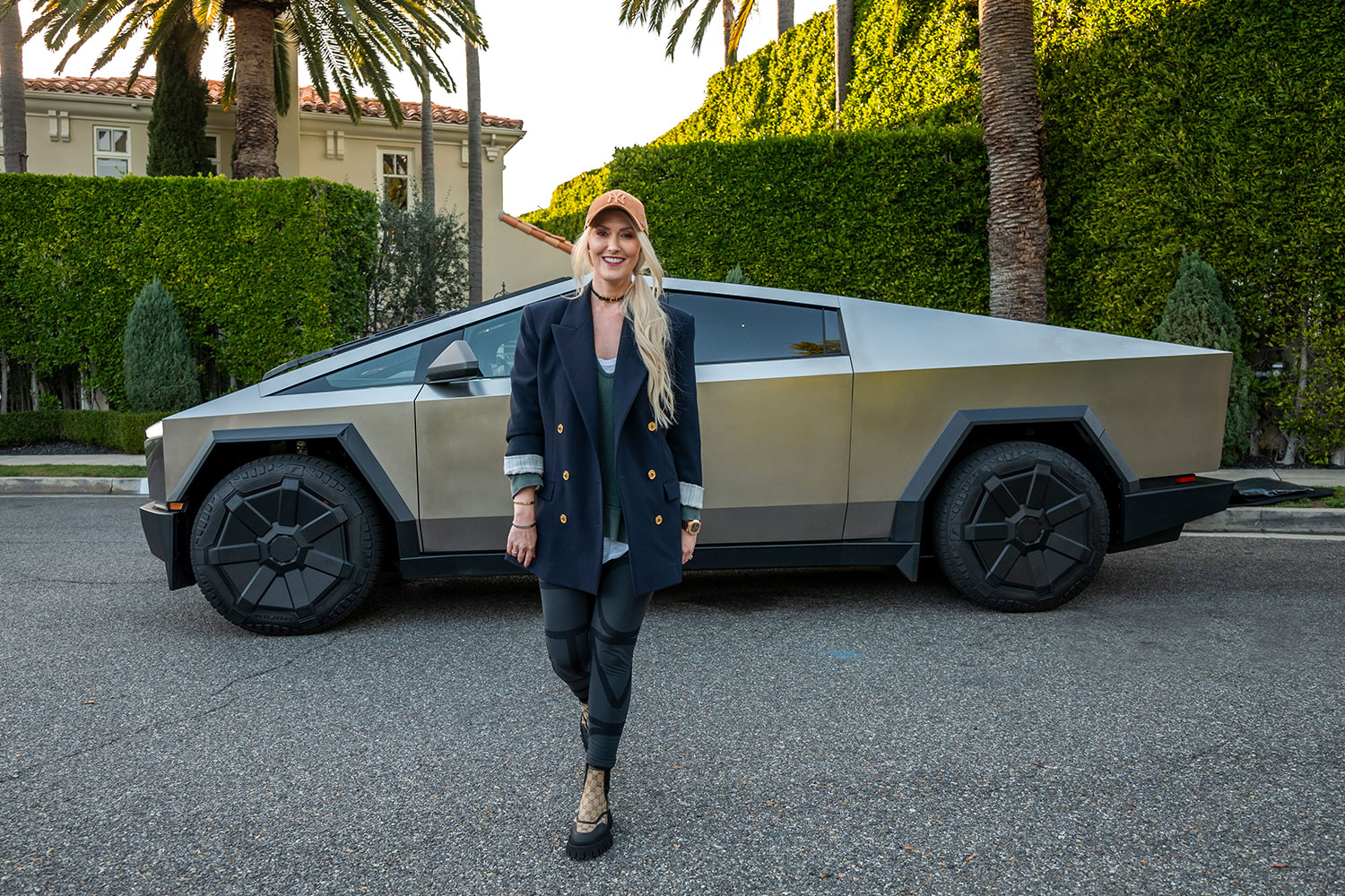 Alex Hirschi, aka Supercar Blondie, standing in front of a Tesla Cybertruck. One of these EVs will be sold on her new auction platform SBX Cars.