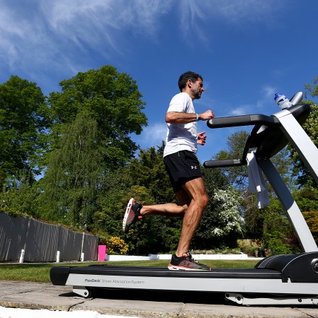 A man running on a treadmill. Interested in the 12-3-30 treadmill workout? Let's take a look at it.