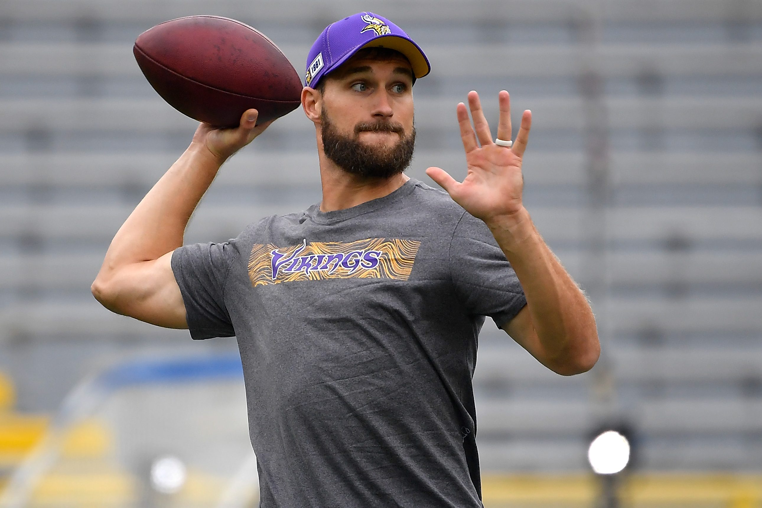 Former Viking Kirk Cousins throws a football. He's one of the quarterbacks heading to a new team during QB carousel season.