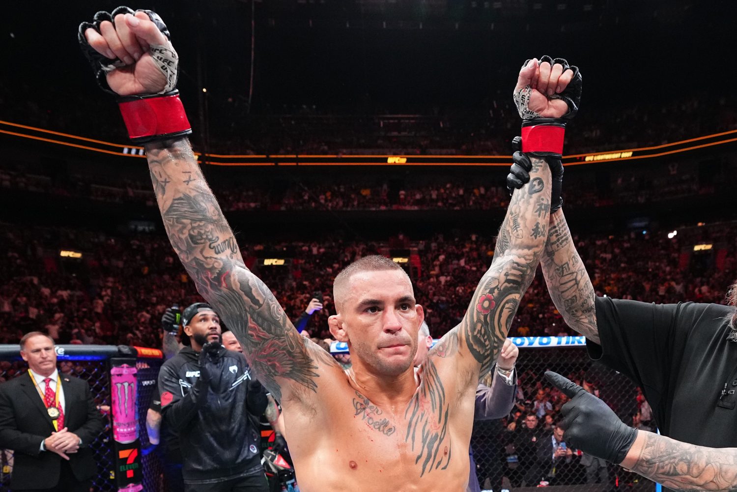 Dustin Poirier holds up his hands in victory.