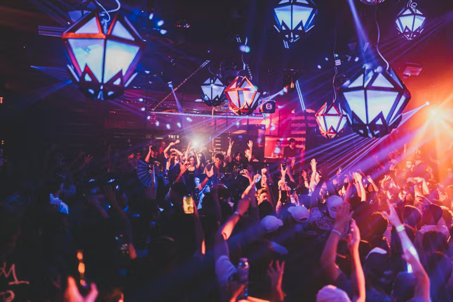 inside of nightclub, people dancing, lights