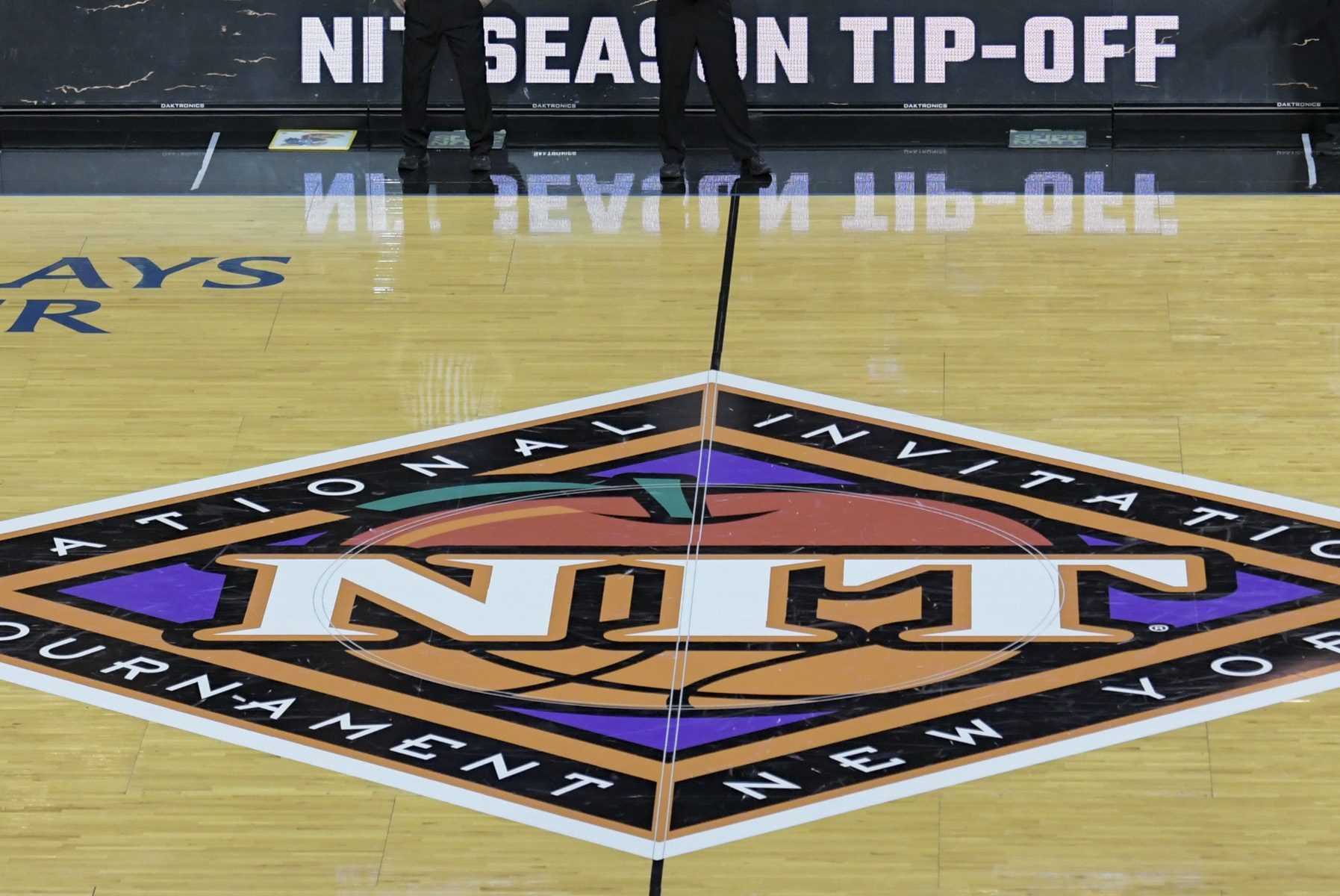 The NIT tournament logo on the floor at the Barclays Center. Here's how the transfer portal is hurting the second-tier tournament.