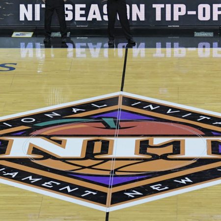 The NIT tournament logo on the floor at the Barclays Center. Here's how the transfer portal is hurting the second-tier tournament.