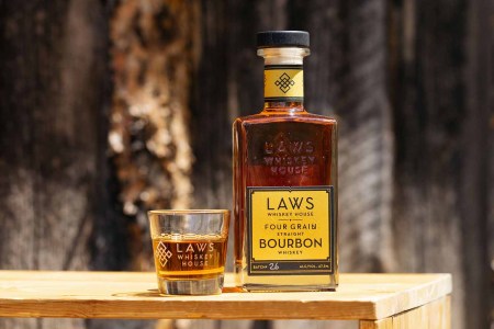 A bottle and a glass of Laws bourbon, from Colorado