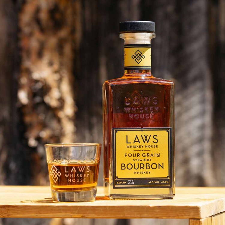 A bottle and a glass of Laws bourbon, from Colorado
