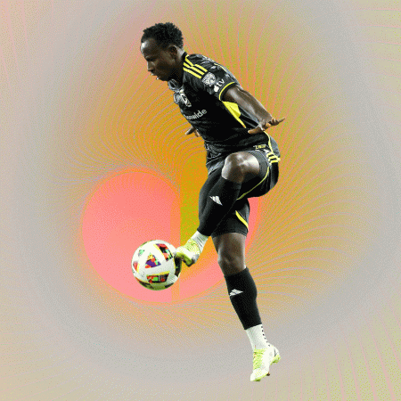 A Columbus Crew player kicking a ball against a trippy background.