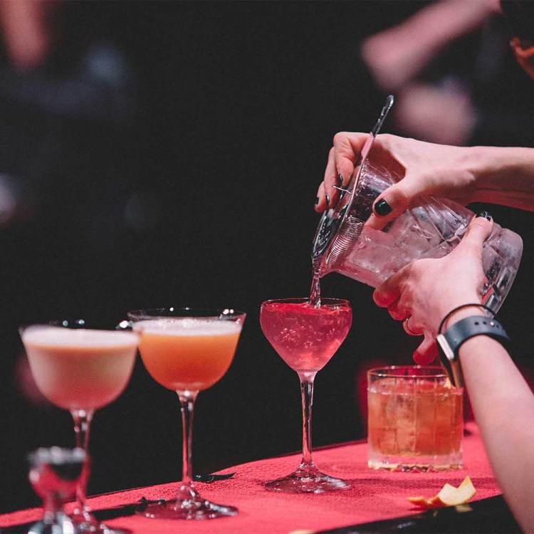A typical Speed Rack bartending competition set up with three cocktails