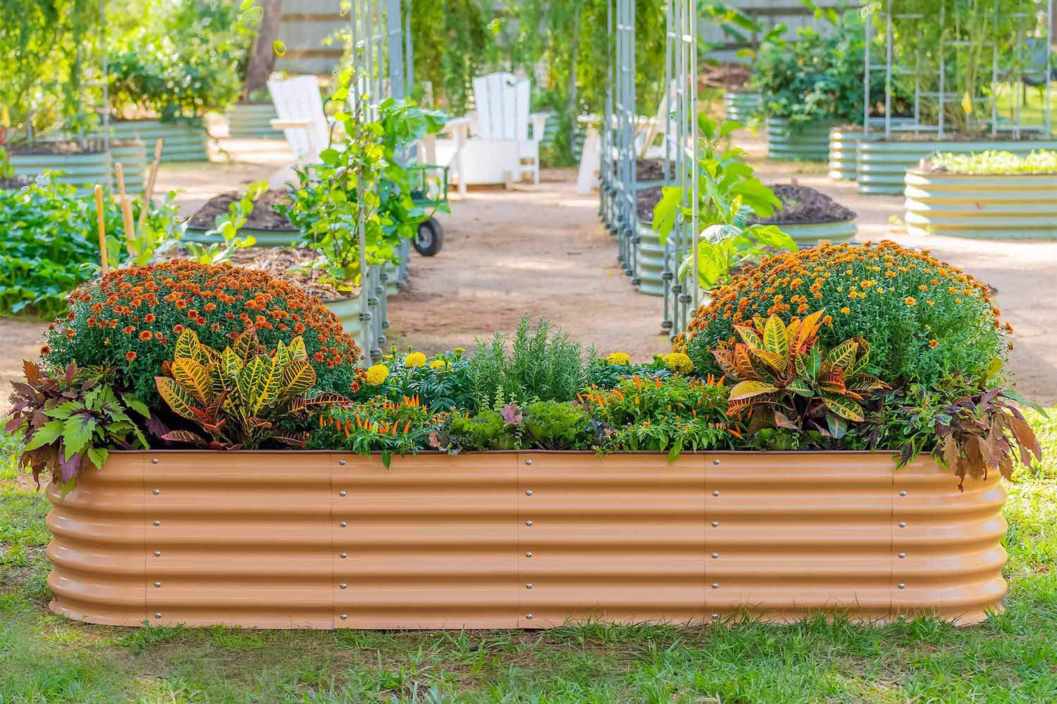 An orange vego garden bed teeming with colorful plants and flowers
