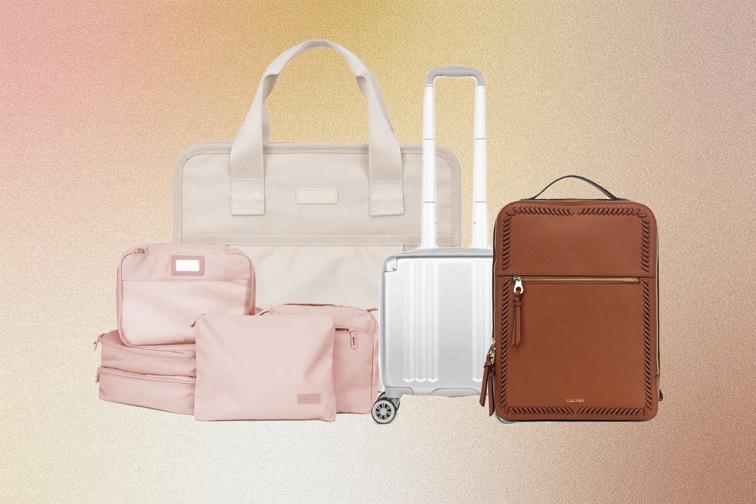 Calpak travel essentials on a pink and yellow background