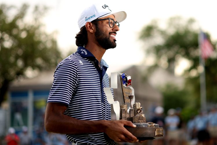 Akshay Bhatia poses with the trophy after winning the Valero Texas Open.