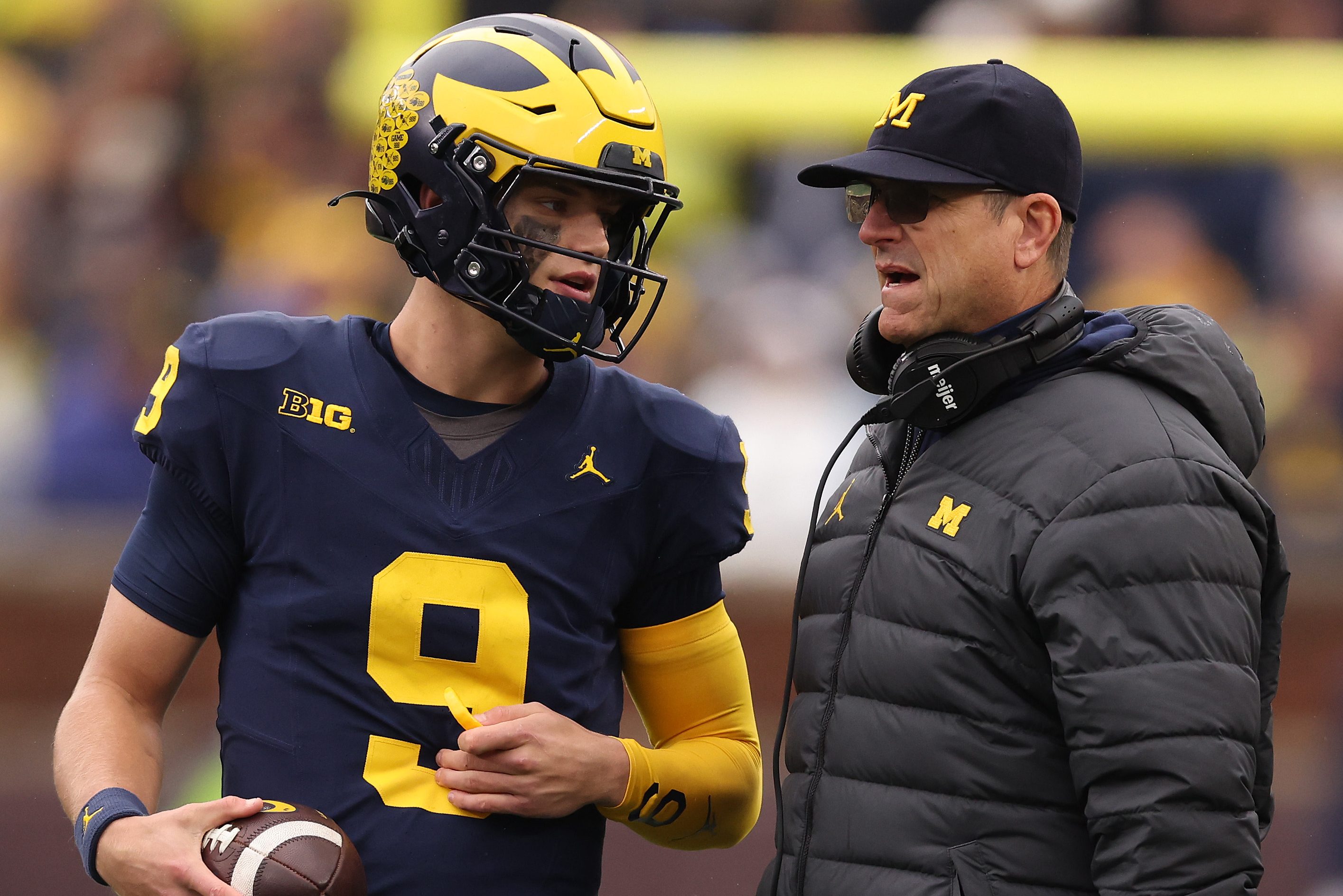 Ex-Michigan Wolverines Jim Harbaugh and J.J. McCarthy.